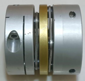 18x32mm bore alumiun couple1 Aluminum flexible shaft coupling C266, 18mm x 32mm size, designed for motor shaft connections in CNC machines and robotics, featuring a durable silver finish with set screws for secure attachment.